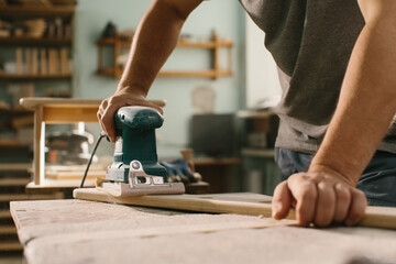 Grinding machine makes wooden polishing of bar plank.