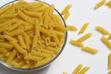 Heap of pasta decorated on a bowl on white background