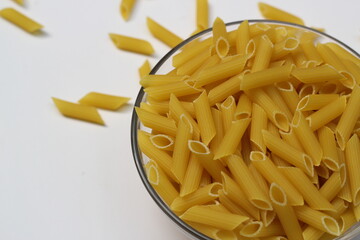 Heap of pasta decorated on a bowl on white background