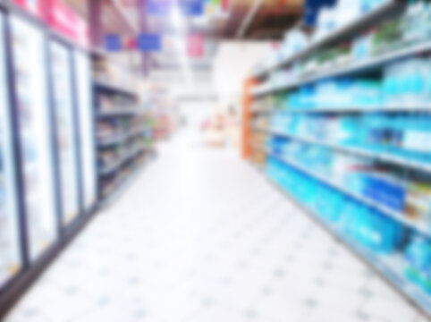 Abstract blur image of supermarket background. Defocused shelves with CPG products, food. Grocery shopping. Store. Retail industry. Rack. Discount. Inflation. Economic crisis concept. Aisle. Recession