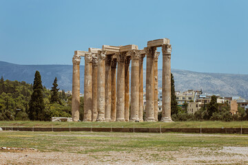 Temple of Zeus, Athens, Greece. These are the famous landmarks of Athens. Sunny view of the ancient...