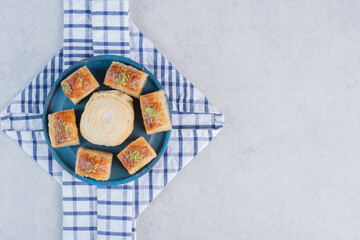 Variety of delicious desserts on wooden board