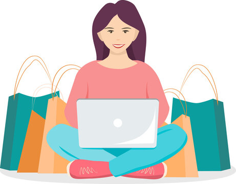 young woman buying many things online using a laptop