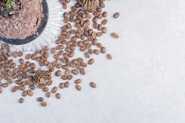 Chocolate cake on glass plate with chocolate chips