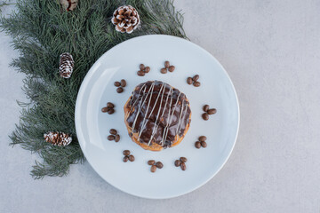 Delicious cookie with chocolate glaze on white plate