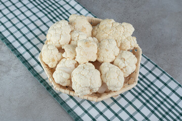 Uncooked fresh cauliflower vegetable on a tablecloth