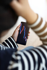 Investment concept in stock market and crypto currency market. a woman is checking using...
