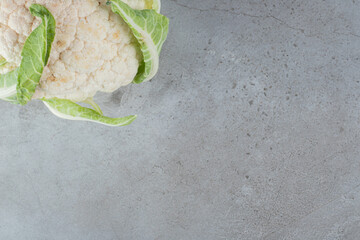 Uncooked fresh cauliflower vegetable on a tablecloth
