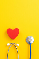 Blue stethoscope with red heart, medical care design concept.