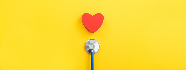 Fototapeta Blue stethoscope with red heart, medical care design concept. obraz