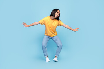 Fototapeta na wymiar Full length photo of young attractive korean woman wear stylish outfit dancing hands posing look dreamy sale shopping isolated on blue color background