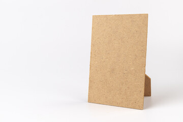 Brown cardboard sheet of paper on white background. Space for your disigne.