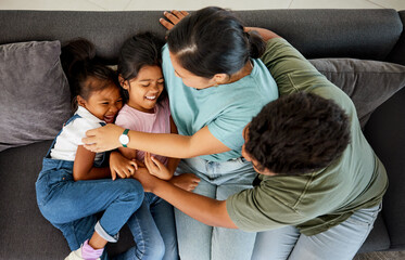 Comic family, happy sofa and parents with love for children on living room couch, tickling for comedy and smile together in lounge. Girl kids laughing while playing with mother and father from above - obrazy, fototapety, plakaty