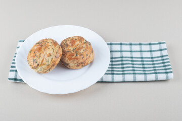 Sour gogals on a platter on folded towel on marble background