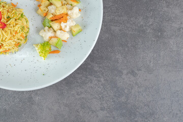 Tasty rice and healthy vegetables on white plate