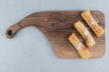 Pancakes on a wooden board on marble background