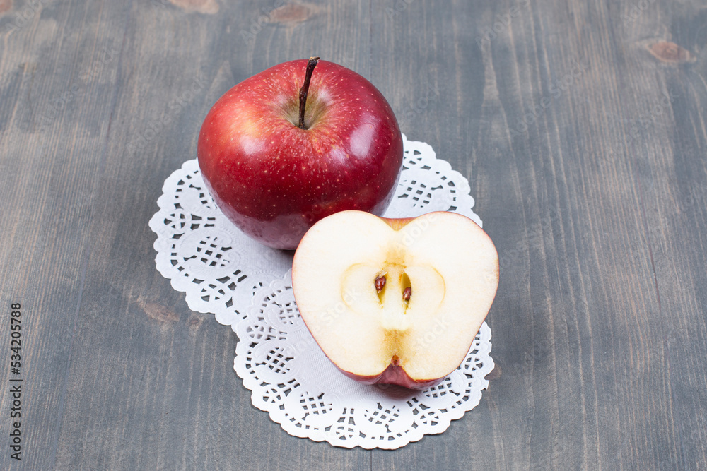 Wall mural Delicious fresh apples on marble background