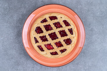 Delicious berry pie on red plate