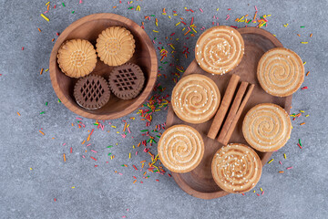 Bunch of sweet crackers on wooden plates