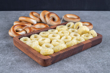 Tasty circle crackers on wooden plate