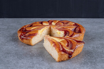 Tasty pie with berry juice on marble background