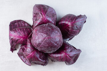 Raw purple cabbage on stone surface