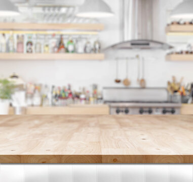 Wood Table Top On Blur Kitchen Background.