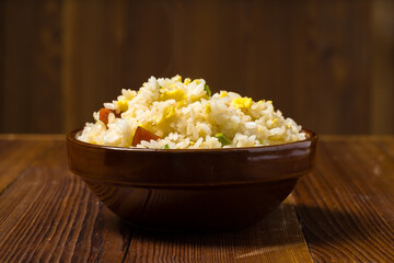 Yangzhou fried rice on wooden background