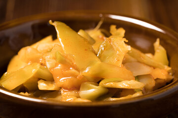 Shredded mustard on wooden background