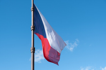 Czech Republic flag waving against blue sky