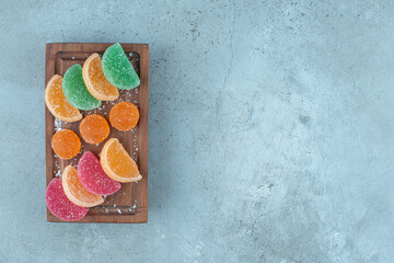 Small platter of marmelades on marble background