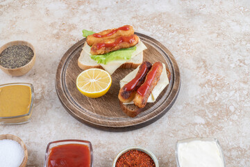 Grilled sausage stick sandwiches with herbs, cheese and sauces