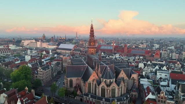 Aerial view of famous places Amsterdam, Netherlands. View of canal and old centre district. span around the church de oude kerk