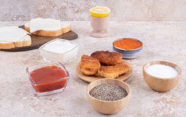 Fried chicken nuggets with lemon and sauces