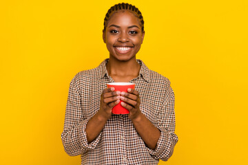 Photo of dreamy sweet woman wear plaid shirt drinking hot tasty beverage isolated yellow color background
