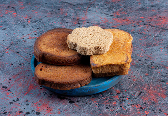 Bread slices isolated in a blue platter
