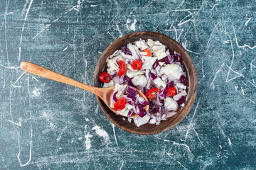 Seasonal vegetable salad with chopped purple cabbage and herbs