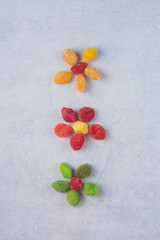 Dried multicolor cherries and berries on concrete background