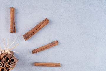 Cinnamon sticks isolated on concrete background
