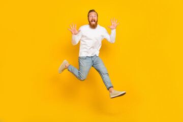 Full body photo of beard impressed man run wear shirt jeans shoes isolated on yellow color background