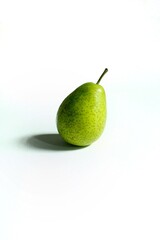 Green pear in white background. Healthy food. Space for text.