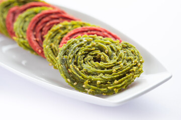 Palak Beetroot chakli or murukku made using spinach and beetroot