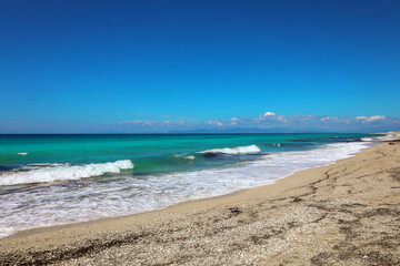 Waves in ionian sea in greece - blue water, white sand