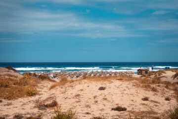 Fototapeta na wymiar Beautiful sandy beach with turquoise water in Cala Mesquida, Mallorca, Spain. Selective focus.