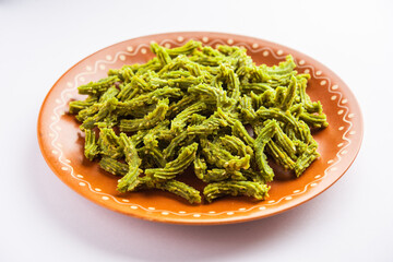 Palak Chakli sticks or Spinach Murukku pieces, healthy Indian festival or tea time snack