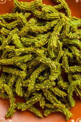 Palak Chakli sticks or Spinach Murukku pieces, healthy Indian festival or tea time snack