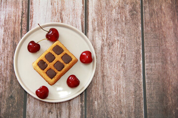 square baked sweet Viennese waffles with chocolate filling in a decorative plate