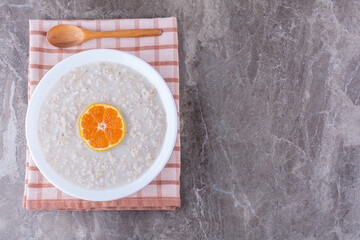 Milky crepes with orange slices on the top
