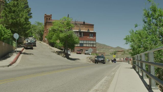 Tourists driving through historic mining town of Jerome, Arizona in summer