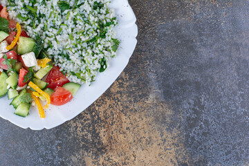 Risotto with herbs and chopped vegetable salad